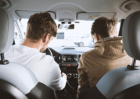 Couple Sitting in Car on Road with Car Insurance in Concord, NC