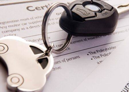Car Keys on Insurance Policy Paper for Car Insurance in Concord, NC
