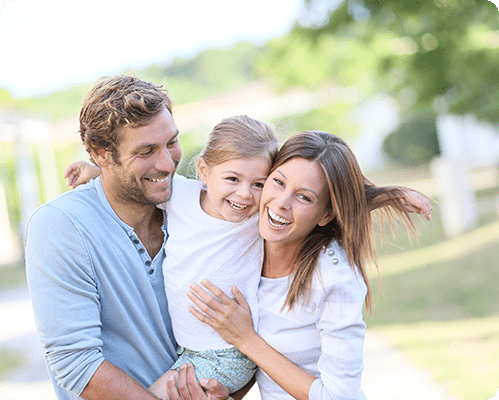 Young family of three smiling