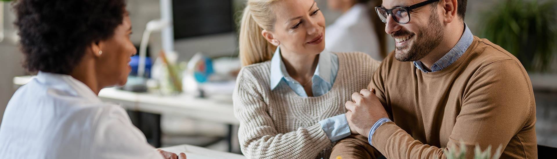 couple meeting with Risk Management, Homeowner's Insurance, Auto Insurance, Business Insurance, and Life & Health Insurance company for the Concord, NC Area