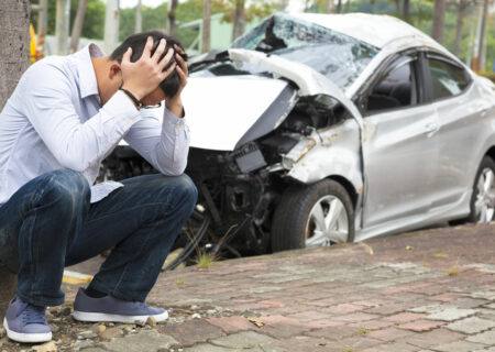 Man Upset in Front of Crashed Car Needing Auto Insurance in Kannapolis, NC