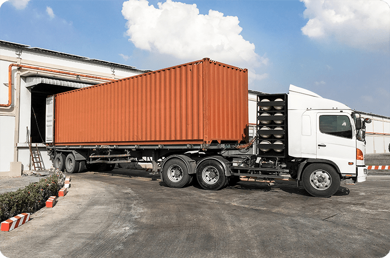 Intermodal Trucking Insurance in Concord, NC, picking up goods from a warehouse at an airport