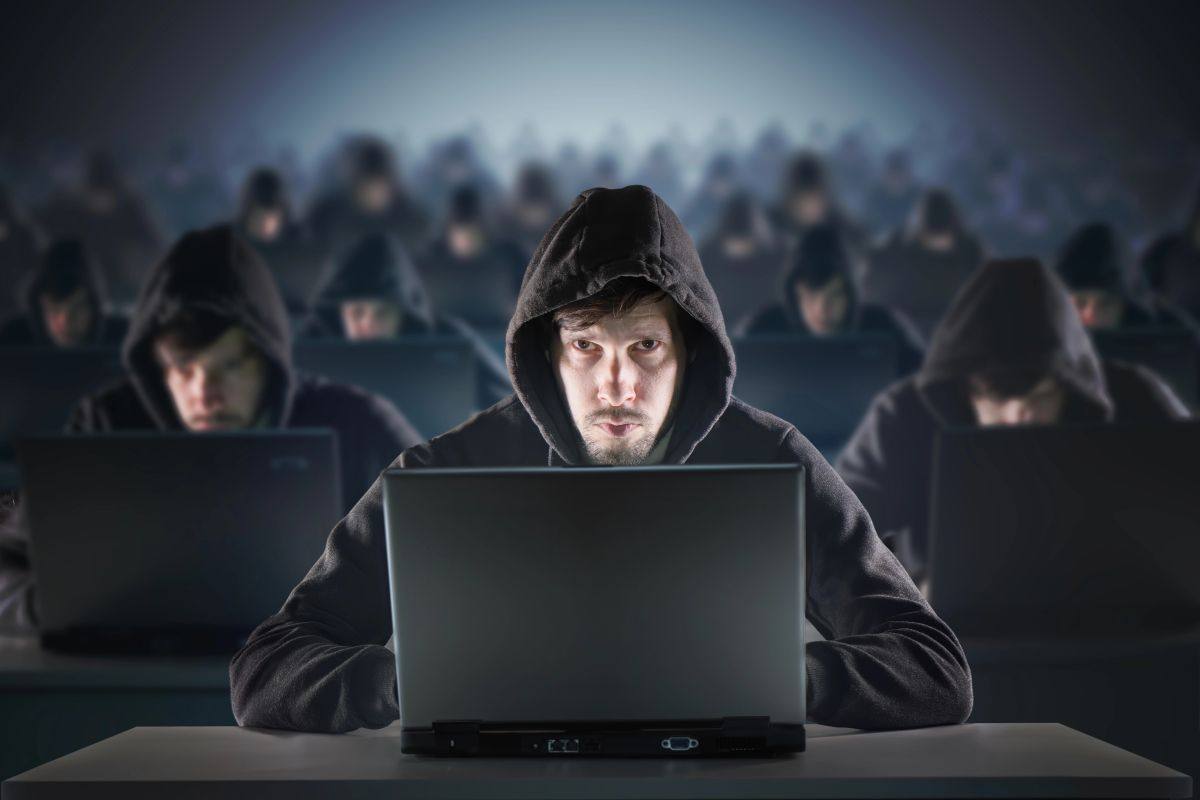 Man behind computer for Cybercrime Liability Insurance in Harrisburg and Mount Pleasant, NC