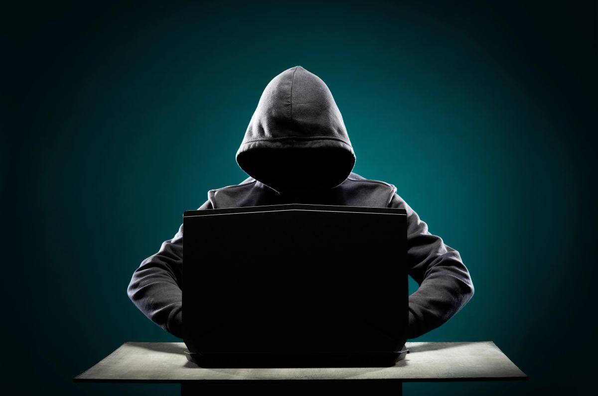 Man behind computer for Cybercrime Liability Insurance in Salisbury