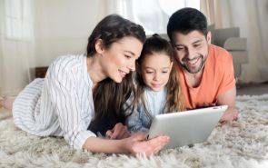 Family in Kannapolis, NC Reviewing Affordable Home Insurance Coverage Options on a Tablet